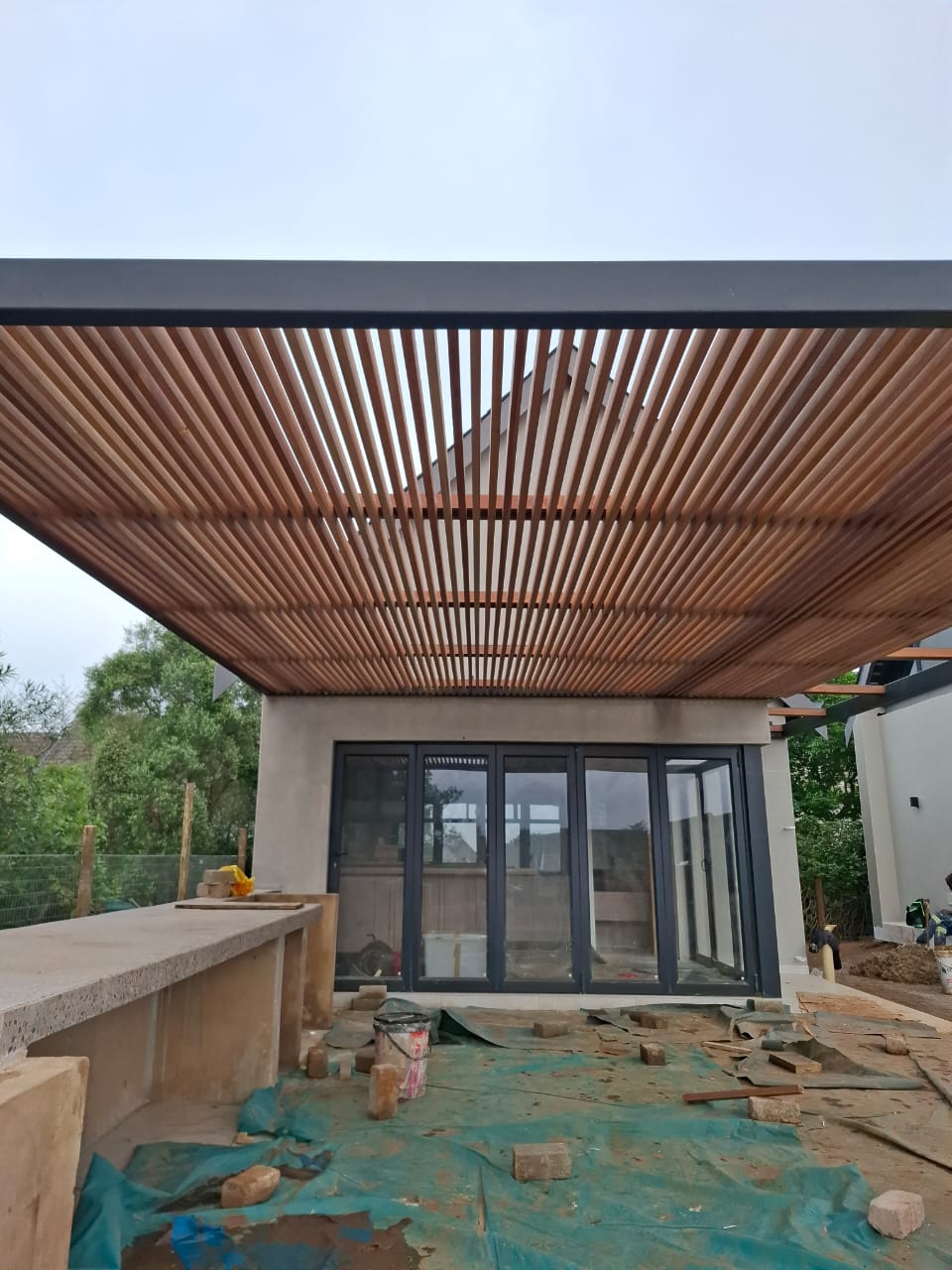 Steel and Balau Pergolas: Where Strength Meets Natural Warmth
